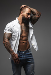 Wall Mural - A man with tattooes on his arms
