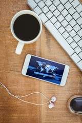Poster - Composite image of coffee and white smartphone with headphones