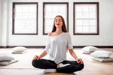 Woman practicing yoga indoors