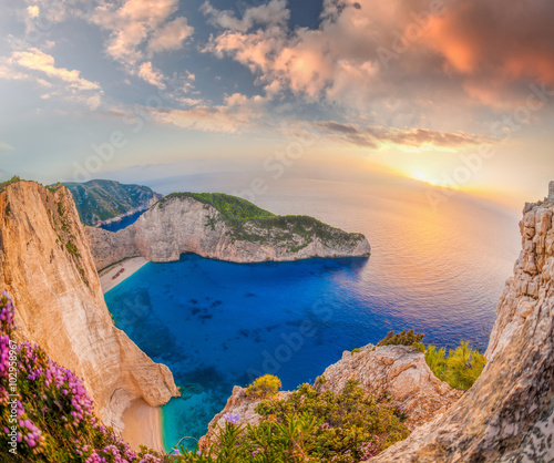 Naklejka dekoracyjna Navagio beach with shipwreck against sunset on Zakynthos island in Greece