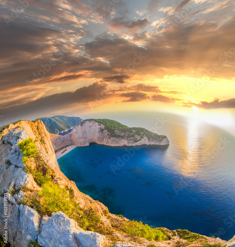Plakat na zamówienie Navagio beach with shipwreck against sunset on Zakynthos island in Greece