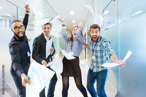 Poster Group of joyful excited business people having fun in office