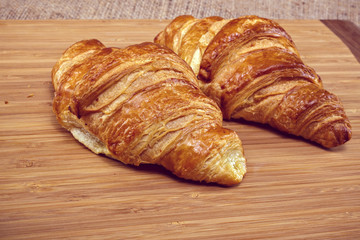 Wall Mural - Freshly baked butter croissant. Studio photo.