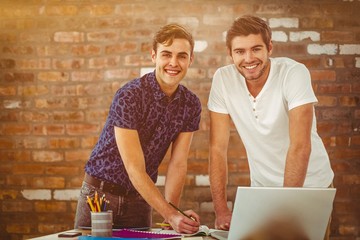 Poster - Composite image of smiling creative team working together