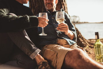 Couple drinking wine on camping