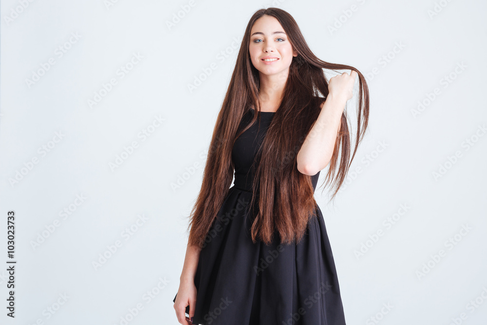 Attractive woman with beautiful long dark hair in black dress Stock ...