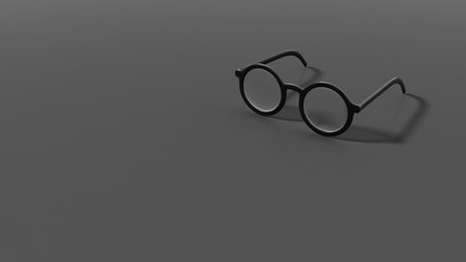 Wall Mural - Pair of black round-lens eyeglasses, isolated on grey/black background.