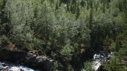 Wall Mural - Top view of beauty waterfall in the tundra of Khibiny mountain at summer season, the south Chargorr pass at the distance. Kuniyok valley, Khibins, Kola peninsula, Russia