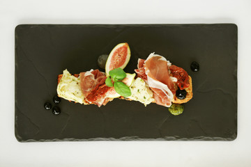 Canvas Print - fig and cured ham bruschetta