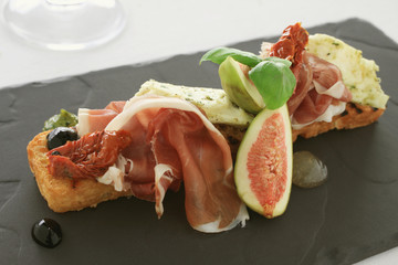 Canvas Print - fig and cured ham bruschetta