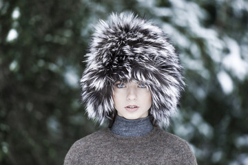 Beautiful girl wearing fur hat