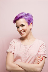 Violet-short-haired woman in pink pastel, laughing