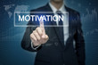 © tonefotografia - Businessman hand touching MOTIVATION button on virtual screen