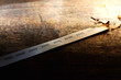 Global warming, Climate change, rising temperature through the decades. Paper strip with timeline charred and burnt on the far end, placed on old wooden table.
