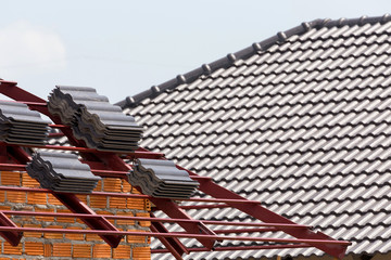 Sticker - black tile roof on residential building construction house