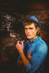 Aufkleber - Composite image of serious hipster smoking pipe