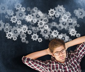 Poster - Composite image of hipster wearing eye glasses lying on hardwood
