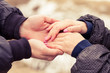 © sunwaylight13 - young couple girl and guy holding hands flower. Early spring in the park.