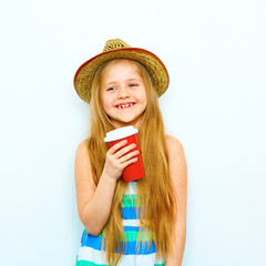 Smiling child girl in hipster style standing against white isol