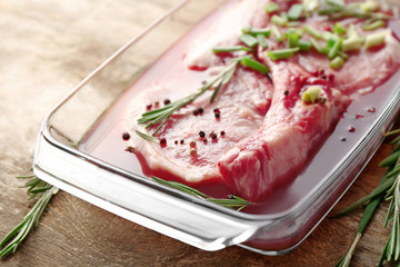 Sticker - Marinating meat with spices on wooden table