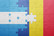 © luzitanija - puzzle with the national flag of honduras and romania