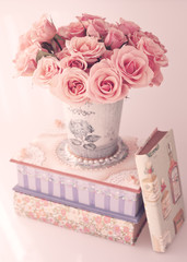 Canvas Print - Roses in a vase over a girly box and vintage books