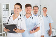 © Andrey Popov - Confident Medical Staff Standing With Doctor