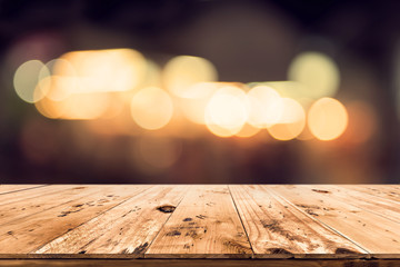 Wall Mural - empty wood table ready for your product display montage. abstract lights gray and white bokeh blurre