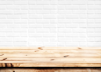 Wall Mural - empty wooden table for product placement or montage with focus to the table top in the foreground, w