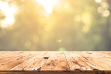 Top Of Wood Table With Blurred Bokeh Nature Background - Empty Ready For Your Product Display Or Montage.