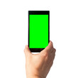 © shujaa_777 - Man holds in hand smartphone in portrait mode with green screen isolated on white. Chroma key screen for placement of your own content.