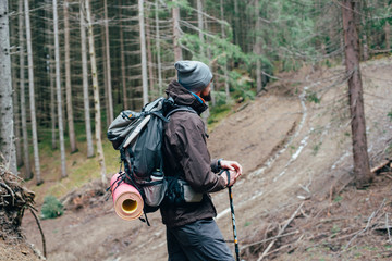 Wall Mural - caucasian male hiking in mountains