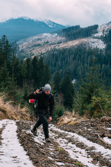 Wall Mural - caucasian male hiking in mountains