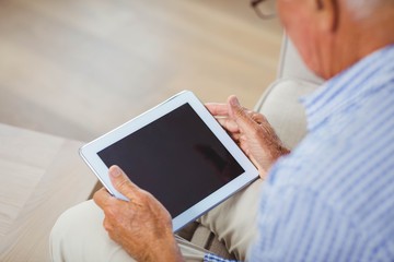 Poster - Senior man using digital tablet