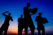 © vladimirzhoga - A group of africans sing national song and dance at the sunset