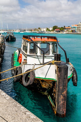 Wall Mural - White Green and Red Fishing Boat Tied to Dock