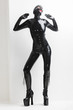© Richard Semik - standing woman wearing latex clothes