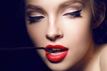 beautiful girl with red lips and hollywood make up