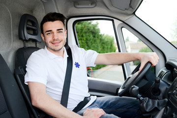 young man driving an ambulance paramedic transportation