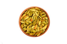 Roasted pumpkin seeds in wooden bowl