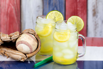 Wall Mural - Glass jars filled with cold lemonade and baseball mitt with ball