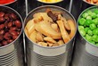 Close up of opened cans of vegetables