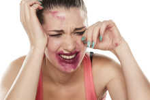 Desperate And Crying Young Woman With Smeared Makeup