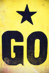 Canvas Print - Letterpress printed go word with star