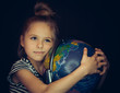Beautiful girl hugging a globe