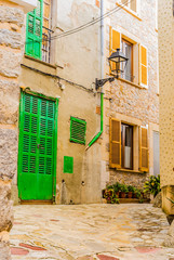 Fototapete - View of old rustic houses with mediterranean stone wall