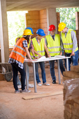 Wall Mural - Teamwork of engineers at construction site