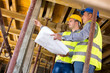 © luckybusiness - Architect with supervisor of the construction site show place of