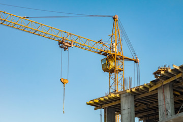 Building under construction and crane.