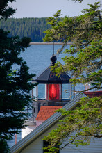 The Beautiful Red Lit Fresnel Lens Of The Bass Harbor Lighthouse